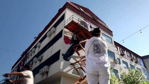 Artists from across the globe have gathered in a small town in Kosovo, transforming its appearance