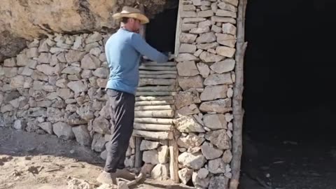Build a shelter in a cave in the wilderness to survive overnight
