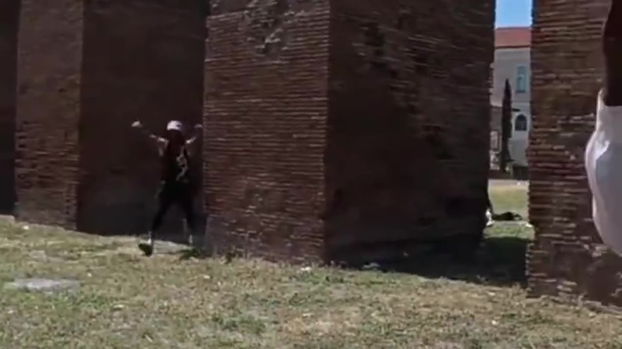 Travel YouTuber visiting a park in Rome, Italy, was confronted by migrants openly using drugs,