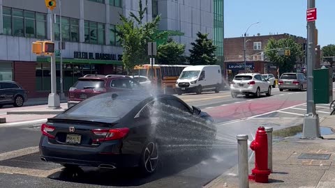 Malfunctioning Fire Hydrant Used As Free Car Wash