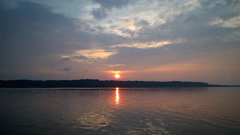 Sunrise St Laurent river birds singing water flow Canada