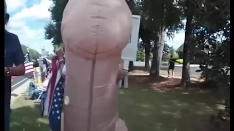 Police Officer Grabs Penis Protestor