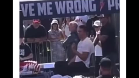 CHARLIE KIRK SHOOTER THAT MADE IMPACT REAL KILLER WHITE T SHIRT HANDGUM TO CHARLIES RIGHT SIDE