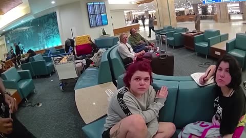 Woman Chokes Ex-Girlfriend in Jealous Rage at Airport