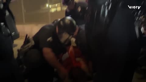 Police clash with anti-ICE protesters as hundreds rally outside LA detention centre