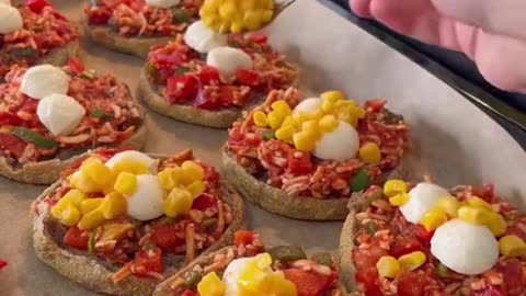 Cooking mini bite pizza, vegetables and cheese topping
