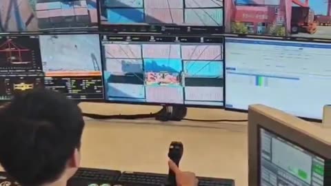 The Chinese port in Guangzhou..Virtual Longshoremen unload ships remotely with 5G