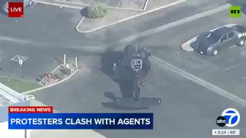 Border patrol Black Hawk on LA street unloads dozens of boxes of arms and ammo
