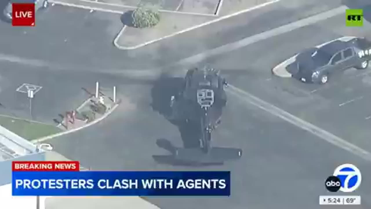 Border patrol Black Hawk on LA street unloads dozens of boxes of arms and ammo