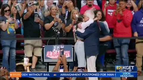 AOC and Bernie Sanders converse in Bakersfield