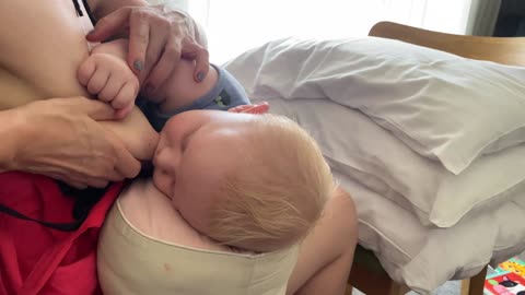 Unlatching a Sleeping Baby with Gentle Breast Compression || 