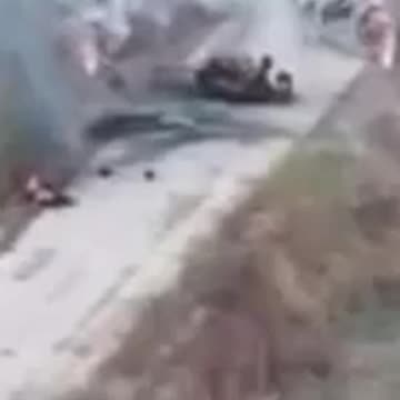 Russian Soldiers Begin to Pile Up After Driving into Wreakage Hidden by Smoke