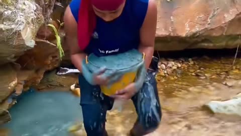 traditonal gold mining from river