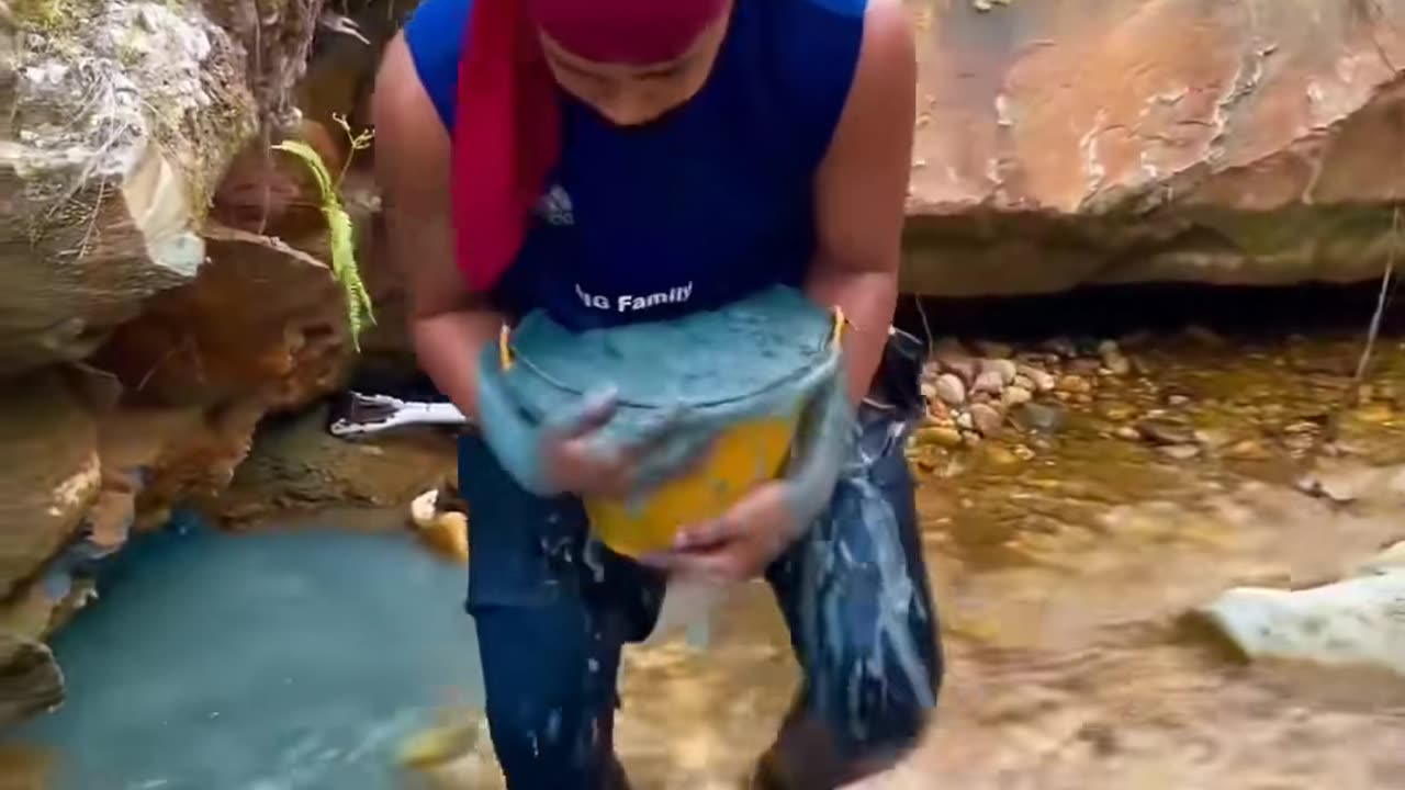 traditonal gold mining from river