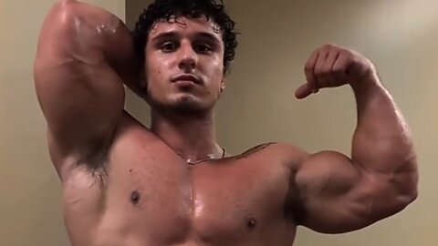 Young man flexing muscles