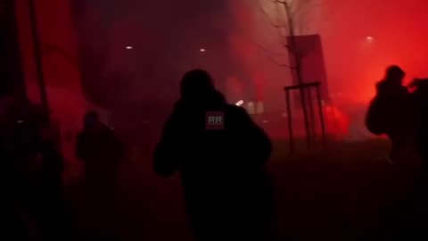 Anti-Olympics protesters fire fireworks directly at media in Milan, Italy.