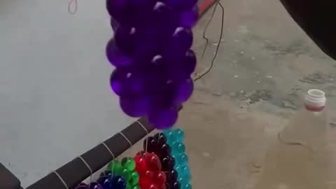 You Won't Believe What He Uses! Street Seller Makes Grape Balloons from Condoms