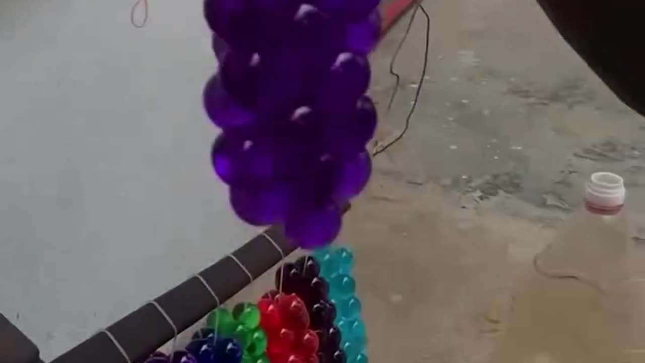 You Won't Believe What He Uses! Street Seller Makes Grape Balloons from Condoms