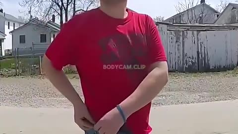 Man Fixes his Belt infront of Family