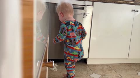 Toddler’s Kitchen Quest: Laughs, Dishwasher Locks & a Silly Glove!