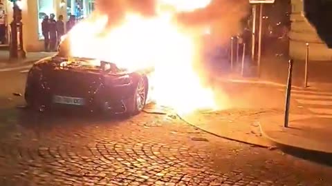 Fires set near the Champs-Élysées as Paris Saint-Germain fans gather to celebrate