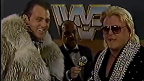 Brutus beefcake in fur coat with Greg valentine-tag team champs