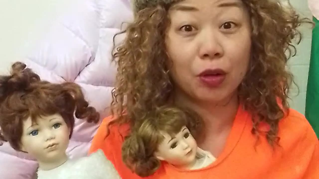 2:35 hat neon and 2 girl dolls