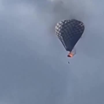 Collin Rugg - NEW： Man falls from the basket of a hot air balloon after it caught #fire