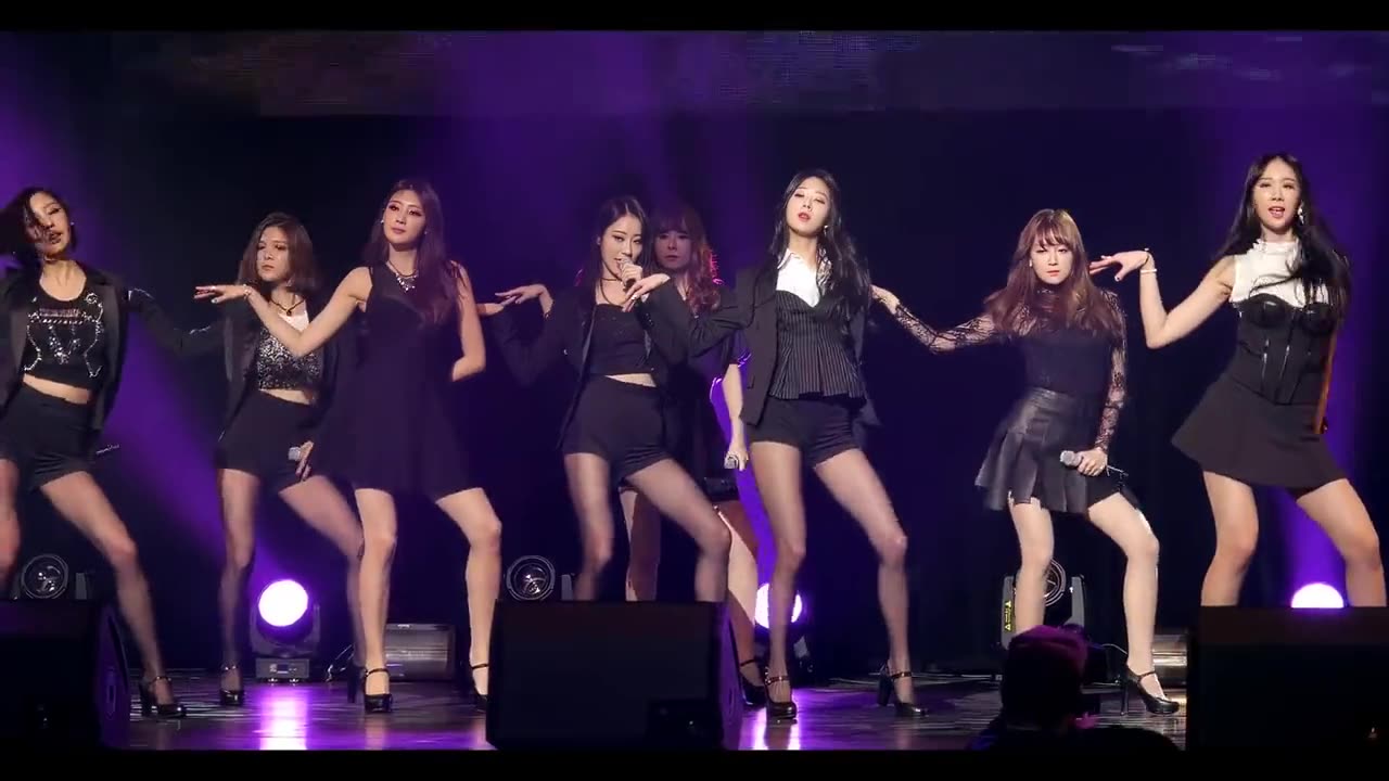 The girl group is giving a high-energy hot dance performance.