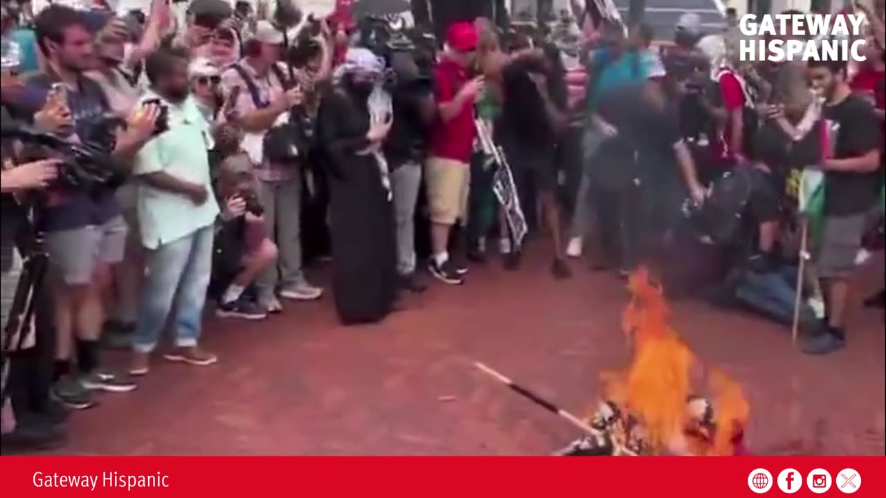 Young Islamists and communists unite to burn U.S. flags and chant “Allahu Akbar.”