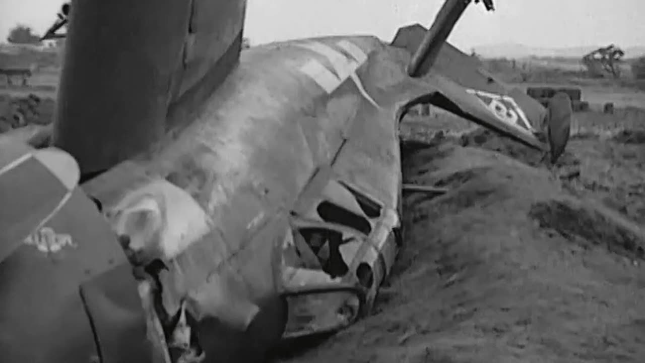 US personnel examine a F4F Wildcat crashed on Okinawa on April 7th 1945