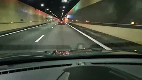 Driving through tunnels and bridges in the French alpine mountains on the A40 Autoroute