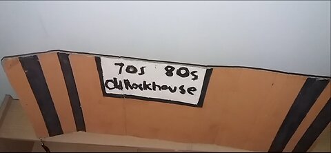 Handmade painted font inside a brown background with black straight lines in the corners