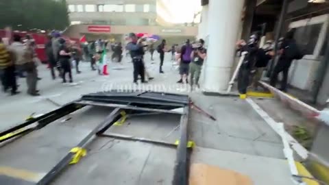 Rioters in Los Angeles are currently attacking an ICE facility, no local police stopping the rioters