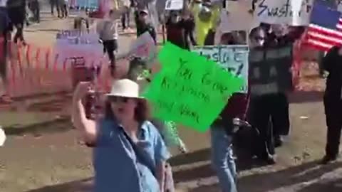 Alex Jones rolls up to a Tesla Dealership in a Cybertruck and humiliates protestors.