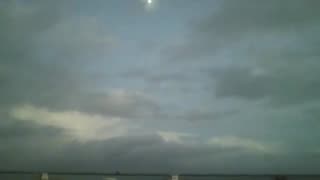 The moon, sky, boats and sea, being filmed at nightfall, in a beautiful view [Nature & Animals]