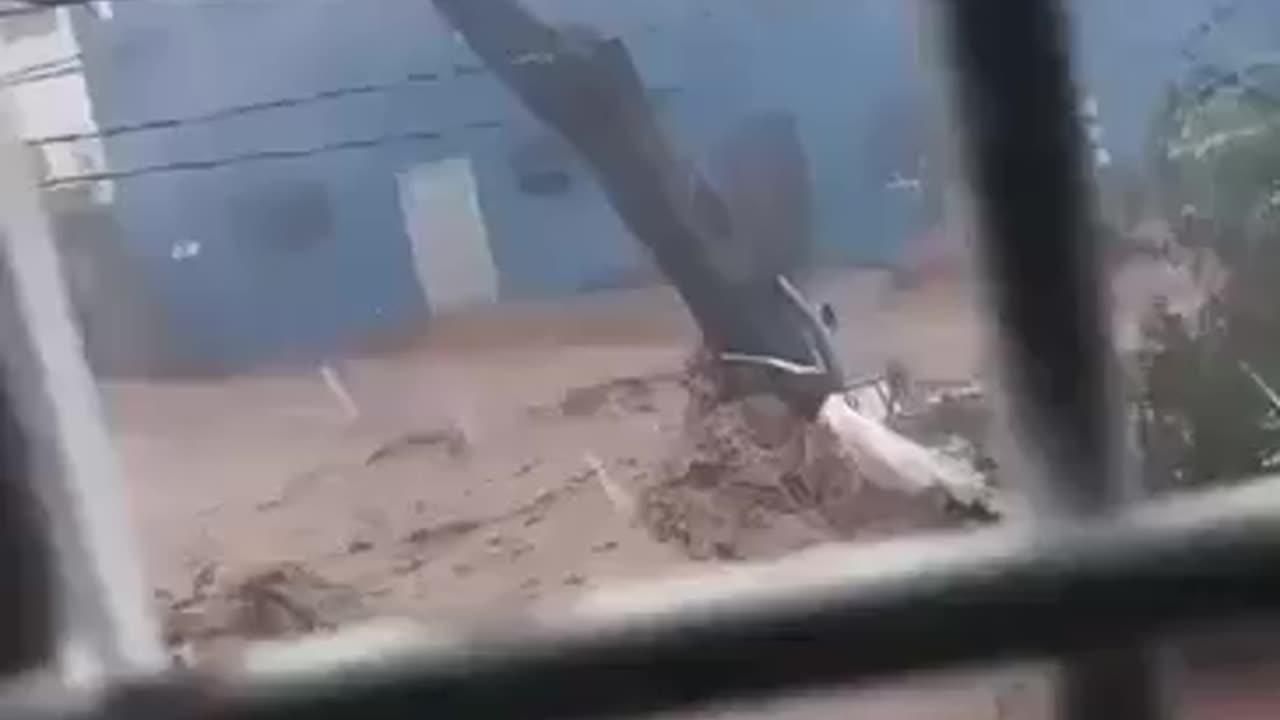 Flooding in Santa Cruz, Jamaica, in the mountains inland from where Hurricane Melissa