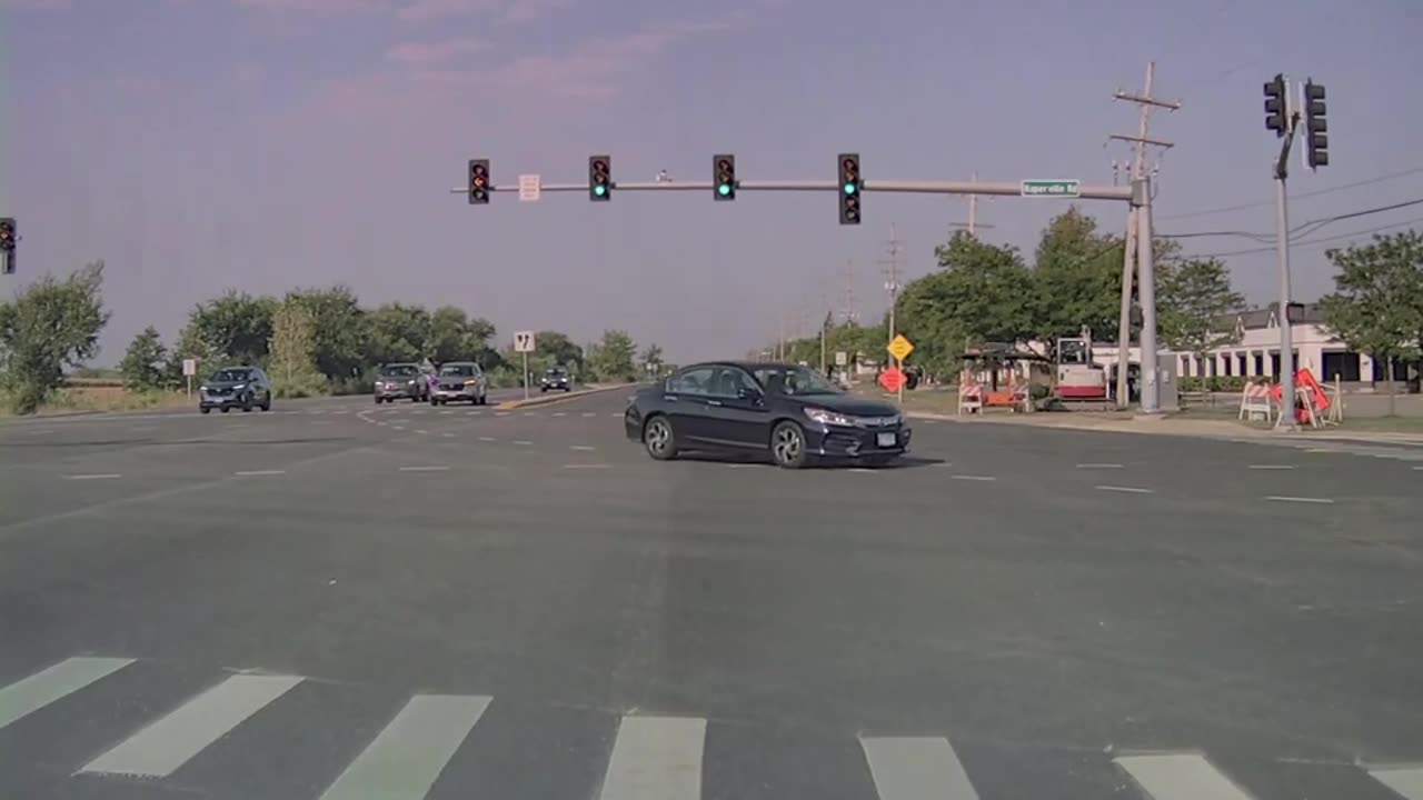 Car Runs Red Light In Front Of Unmarked Police SUV