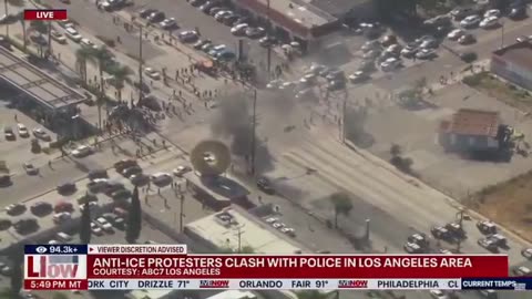 Anti-ICE rioters waving Mexican flags SET A VEHICLE ON FIRE in the LA area