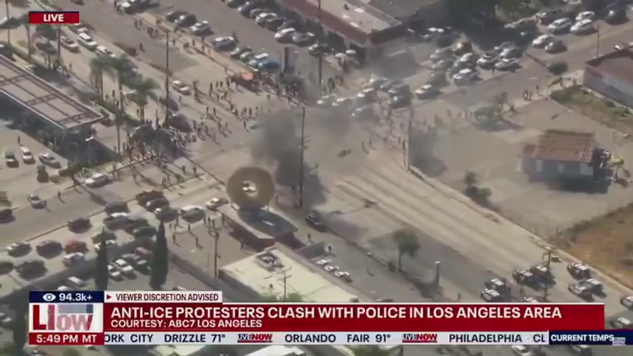 Anti-ICE rioters waving Mexican flags SET A VEHICLE ON FIRE in the LA area