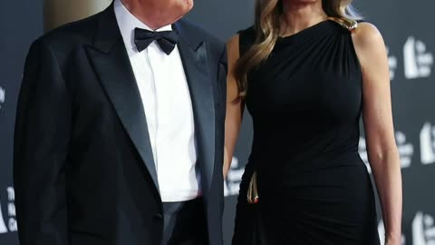The First Lady of America is stylish in a black evening gown and matches Trump at the performance