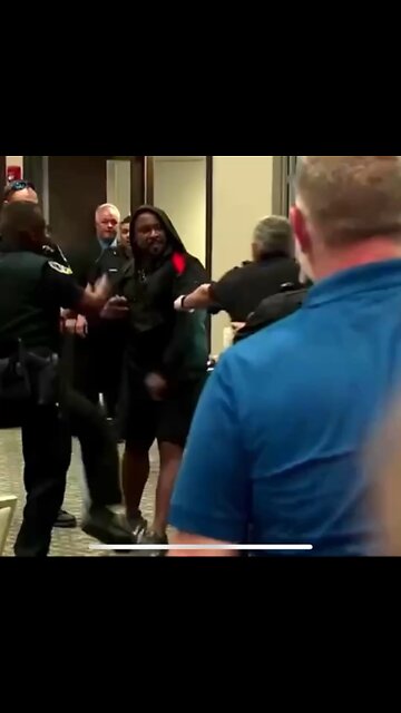 Marjorie Taylor Greene standing strong against crazy, protesting Democrats in a Town Hall.