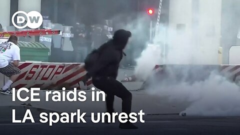 Los Angeles riot police fire 'flash-bang' rounds at protesters after violent immigration raids
