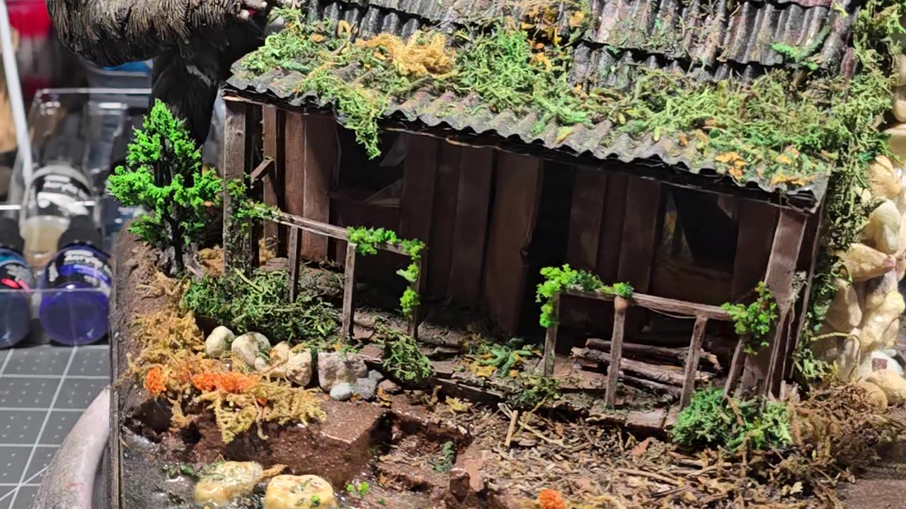Cardboard house with clay yeti