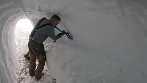 Dugout shelter under 10ft (3m) of snow solo camping in survival shelter during snowstorm