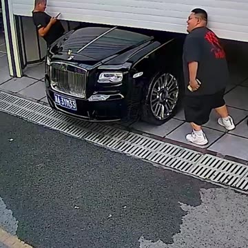 Trying to lift the garage door from the car.hd