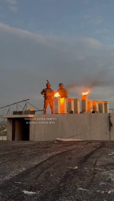 Jews Lighting a Hanukkah candles on the roof of the Indonesian Hospital in Gaza after destroying it.