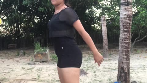 Daughter Imitates Mom Doing Squats