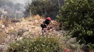 Hundreds of firefighters battle wildfires on Greek island Chios