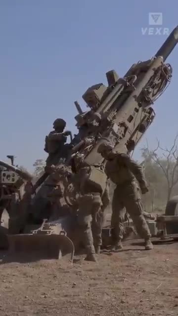 Firing_Howitzers_at_Extreme_High_Angles